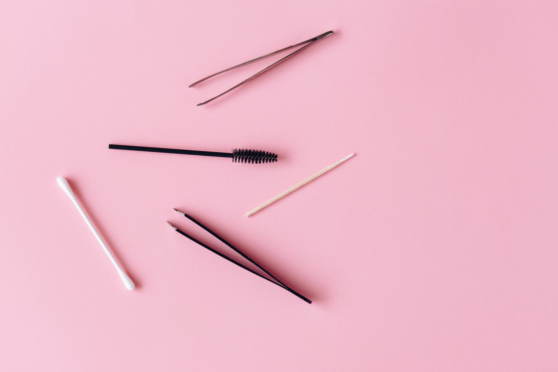 Silver Hair Brush on Pink Surface